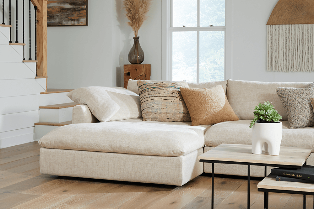 Espen_4pc_Sectional_Willow_Oatmeal_Lifestyle_Detail closeup shot of beige modern sectional corner with neutral pillows